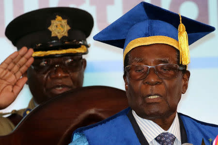Zimbabwe President Robert Mugabe attends a university graduation ceremony in Harare, Zimbabwe, November 17, 2017. REUTERS/Philimon Bulawayo