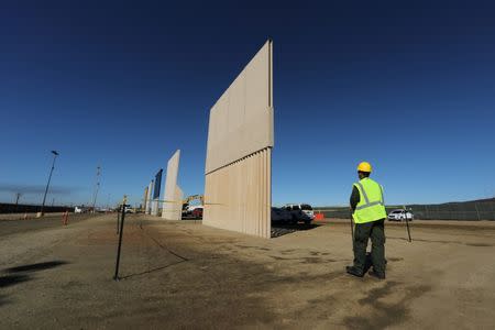 Five of U.S. President Donald Trump's eight border wall prototypes are shown near completion along U.S.- Mexico border in San Diego, California, U.S., October 23, 2017. REUTERS/Mike Blake