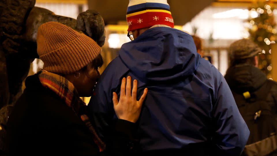 People embrace in front of Charles University main building following the shooting at one of its buildings in Prague. - David W Cerny/Reuters