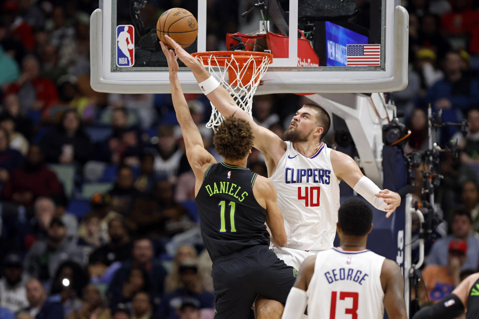 New Orleans Pelicans guard Dyson Daniels (11) is fouled by Los Angeles Clippers center Ivica Zubac (40) in the first half of an NBA basketball game in New Orleans, Friday, Jan. 5, 2024. (AP Photo/Tyler Kaufman)