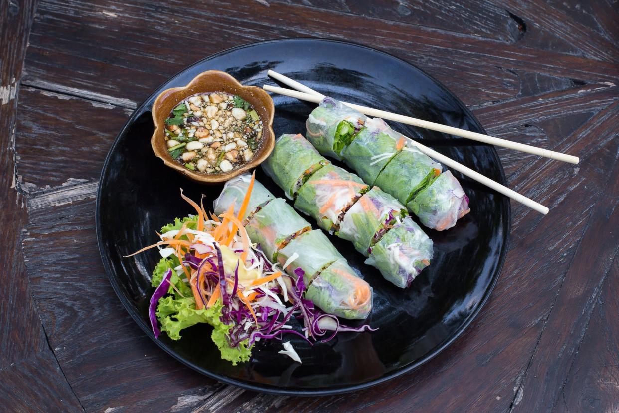 Fresh vietnamese spring rolls on a plate with salad