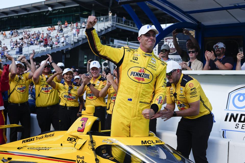 Scott McLaughlin, front, of New Zealand, celebrates after winning the pole for the Indianapolis 500 auto race at Indianapolis Motor Speedway, Sunday, May 19, 2024, in Indianapolis. (AP Photo/Darron Cummings)