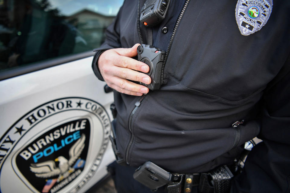 <p>In this Feb. 16, 2017 photo, Burnsville Police Sgt. Chris Wicklund turns his his body camera off after completing a call in Burnsville, Minn. When a Minneapolis police officer shot and killed Justine Damond, who had called in a possible crime in the alley behind her house on July 15, his body camera wasn’t running. Criminal-justice experts say the early numbers suggest that officers aren’t turning them on often enough, and Minneapolis isn’t the only city where that’s the case. (Photo: Glen Stubbe/Star Tribune via AP) </p>