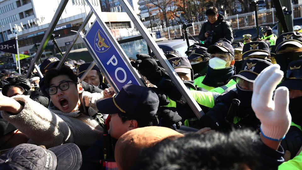 Dogs farmers scuffle with police officers during a protest on November 30, 2023 in Seoul, South Korea. - Chung Sung-Jun/Getty Images