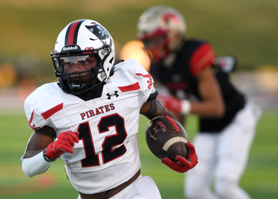 Lubbock-Cooper's Jayden Hibbler runs with the ball against Coronado in a District 2-5A Division I football game, Friday, Sept. 29, 2023, at Lowrey Field at PlainsCapital Park.