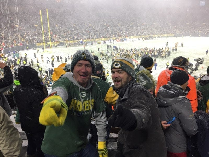 Justin Sterna, left, and Brad Behlmer at a Green Bay Packers game at Lambeau Field.