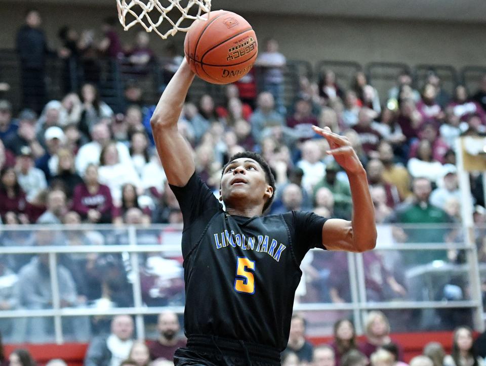 Lincoln Park's Meleek Thomas shoots during Monday's PIAA Class 4A semifinal game against Uniontown at Charleroi High School.