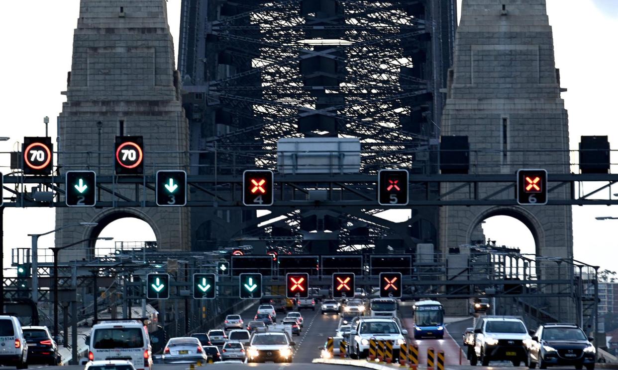 <span>Drivers on the Sydney Harbour Bridge and tunnel would be forced to pay fees in both directions under the NSW government’s interim report of its review into Sydney’s toll road network.</span><span>Photograph: Saeed Khan/AFP/Getty Images</span>