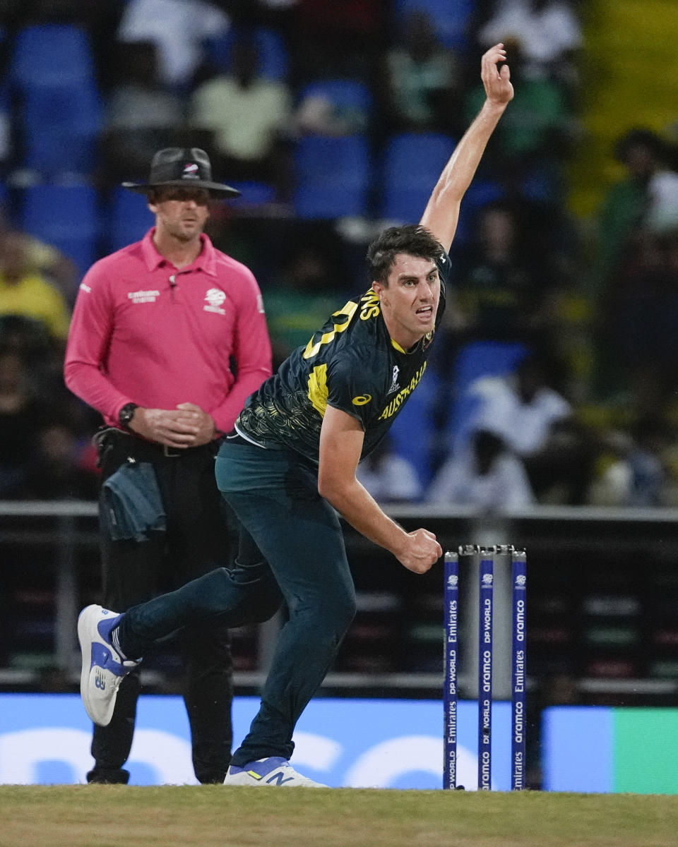 Australia's Pat Cummins bowls during the ICC Men's T20 World Cup cricket match between Australia and Bangladesh in North Sound, Antigua and Barbuda, Thursday, June 20, 2024. (AP Photo/Lynne Sladky)