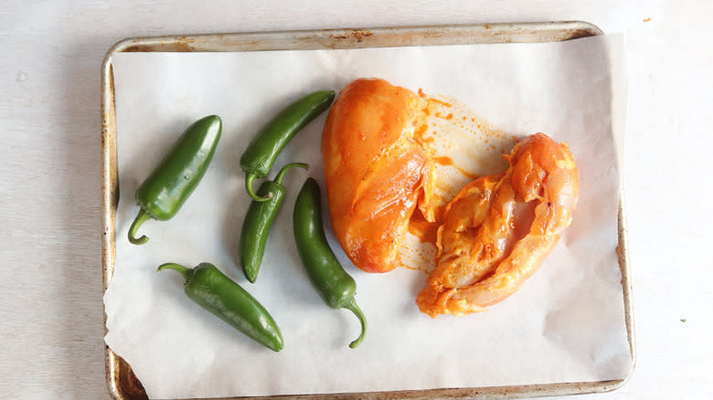 chicken and jalapenos on a sheet pan