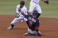 Washington Nationals' Alcides Escobar (3) is safe on second as Miami Marlins second baseman Jazz Chisholm Jr. is late with the tag during the sixth of a baseball game, Tuesday, Sept. 21, 2021, in Miami. (AP Photo/Marta Lavandier)