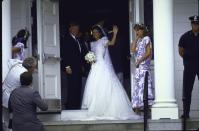 <p>Caroline Kennedy gives photographers gathered outside of the church a final wave before walking down the aisle with her uncle, Ted Kennedy. The former First Daughter married Edwin Schlossberg on July 19, 1986. </p>