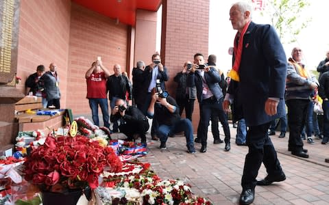 Labour leader Jeremy Corbyn visits the Hillsborough memorial at Anfield in Liverpool before he attends the match between Liverpool and Southampton - Credit: Stefan Rousseau/PA Wire