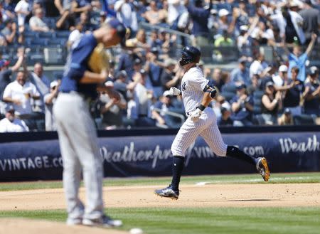 Jun 16, 2018; Bronx, NY, USA; New York Yankees left fielder Giancarlo Stanton (27) rounds the bases after hitting a home run in the fifth inning against the Tampa Bay Rays at Yankee Stadium. Mandatory Credit: Noah K. Murray-USA TODAY Sports