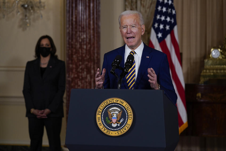 Vice President Kamala Harris, left, looks on as President Joe Biden delivers a speech on foreign policy, at the State Department on Feb. 4, 2021, in Washington, D.C. (AP Photo/Evan Vucci)