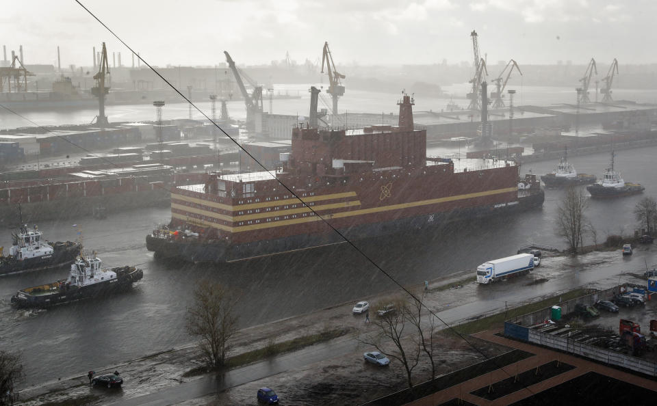 FILE - In this Saturday, April 28, 2018 file photo, the floating nuclear power plant, the 'Akademik Lomonosov', is towed out of the St. Petersburg shipyard where it was constructed in St. Petersburg, Russia. The Akademik Lomonosov that carries two 35-megawatt nuclear reactors set out Friday Aug. 23, 2019, from the Arctic port of Murmansk on the Kola Peninsula on a three-week journey to Pevek on the Chukotka Peninsula. (AP Photo/Dmitri Lovetsky, File)