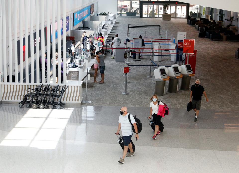 Passengers prepare to fly at Daytona Beach International Airport, Monday, July 26, 2021.