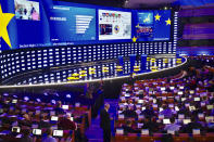 Ongoing projections of results are projected on a large screen in the press room at the European Parliament in Brussels, Sunday, May 26, 2019. From Germany and France to Cyprus and Estonia, voters from 21 nations went to the polls Sunday in the final day of a crucial European Parliament election that could see major gains by the far-right, nationalist and populist movements that are on the rise across much of the continent. (AP Photo/Olivier Matthys)