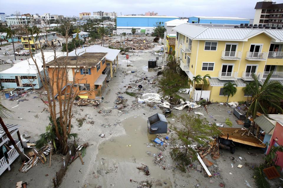 Damages homes and businesses are seen in Fort Myers Beach, Fla., on Thursday, Sep 29, 2022, following Hurricane Ian. (Douglas R. Clifford/Tampa Bay Times via AP)