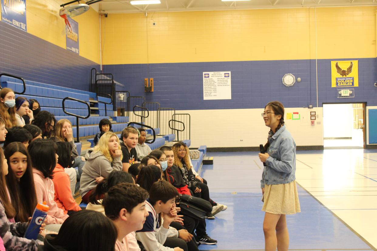 Northern State University student Cheng Chen speaks in front of the Simmons Middle School language club last week.