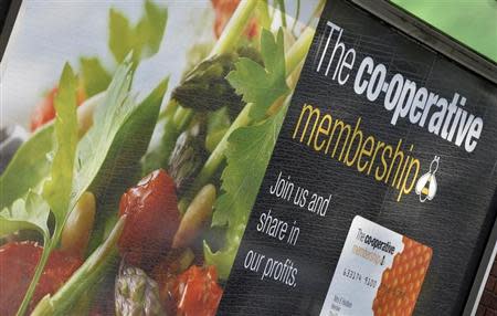 A sign is seen outside a Co-operative retail store in east London, April 10, 2014. REUTERS/Toby Melville