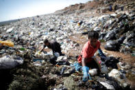 A child works at 'Lixao da Estrutural', Latin America's largest rubbish dump, in Brasilia, Brazil, January 19, 2018. REUTERS/Ueslei Marcelino