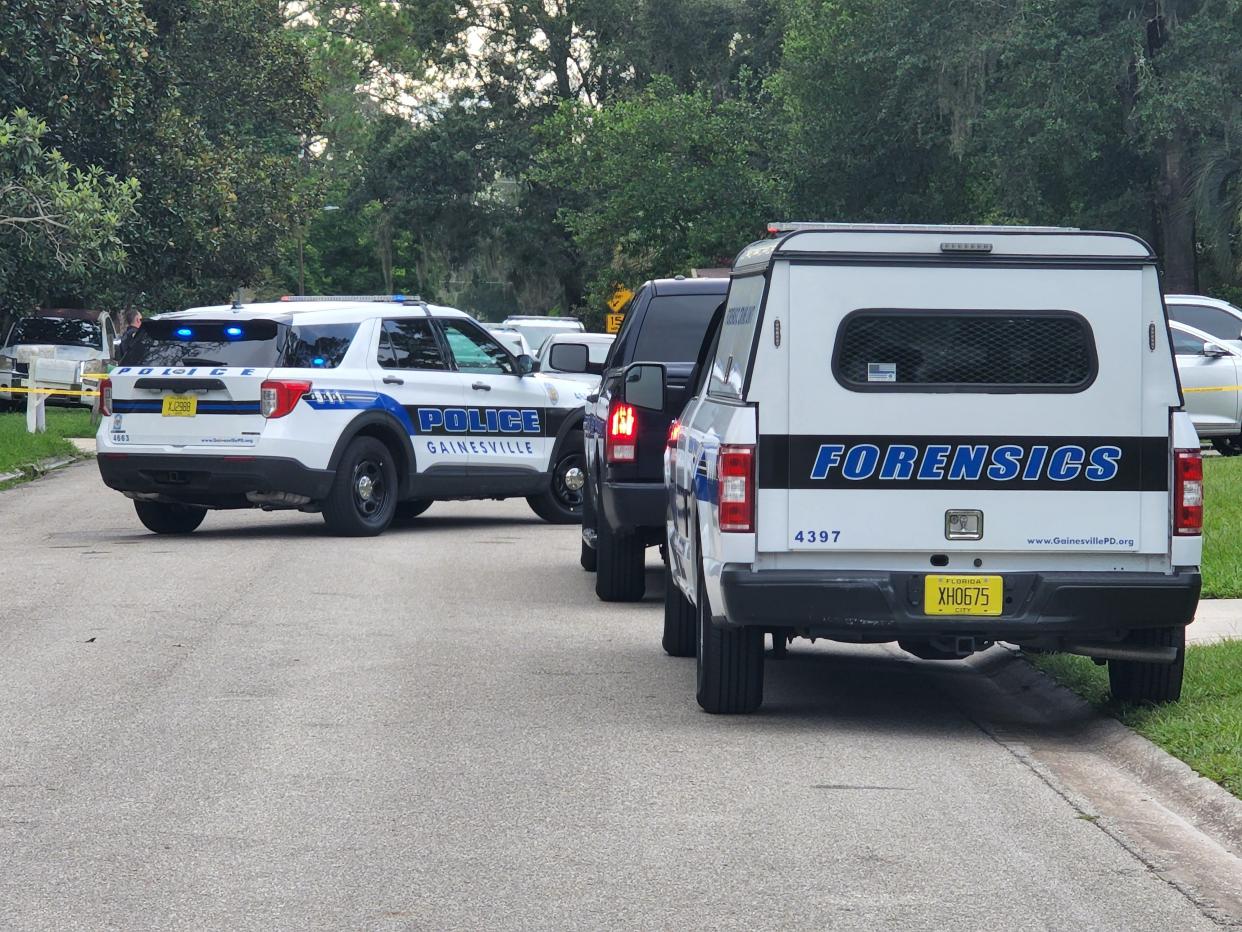 GPD units parked near a crime scene in Northeast Gainesville where a shooting occurred Tuesday morning, July 19, 2022, killing at least one.