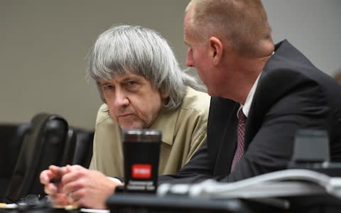 David Turpin, left, listens to his attorney during a sentencing hearing Friday - Credit: AP