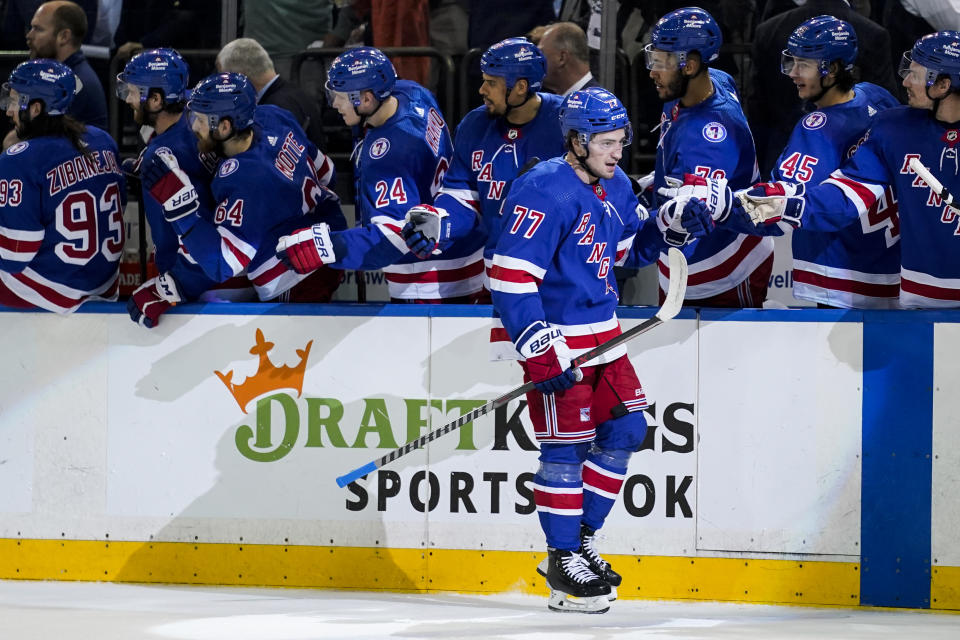 New York Rangers center Frank Vatrano (77) celebrates after scoring on Carolina Hurricanes goaltender Antti Raanta in the first period of Game 4 of an NHL hockey Stanley Cup second-round playoff series, Tuesday, May 24, 2022, in New York. (AP Photo/John Minchillo)