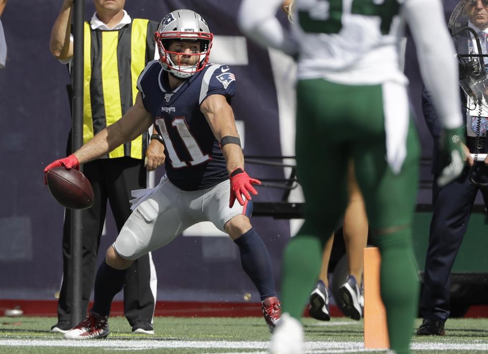 New England Patriots wide receiver Julian Edelman winds up to spike the ball after catching a touchdown pass against the New York Jets in the first half of an NFL football game, Sunday, Sept. 22, 2019, in Foxborough, Mass. (AP Photo/Steven Senne)
