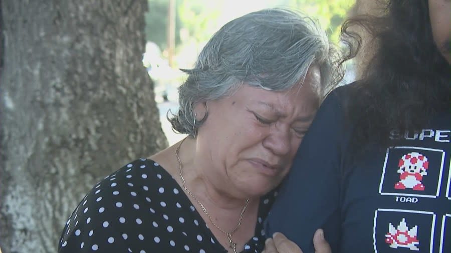 Hugo Cachua's mother, Luc Cachua, mourns the loss of her son at a vigil in Ontario on June 6, 2024. (KTLA)