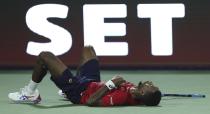 Gael Monfils of France falls to the ground in a semi final match against Serbia's Novak Djokovic at the Dubai Duty Free Tennis Championship in Dubai, United Arab Emirates, Friday, Feb. 28, 2020. (AP Photo/Kamran Jebreili)