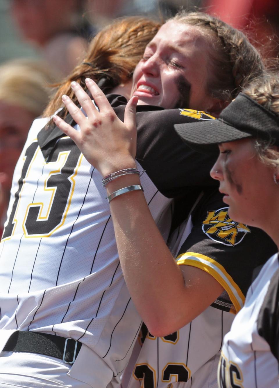Watkins Memorial catcher Jordyn Wycuff, right, hugs pitcher Carsyn Cassady after a loss to Whitehouse Anthony Wayne in a Division I state semifinal last June. Wycuff, who has signed with Ohio University, has been ranked among the state's top 24 players in 2024.