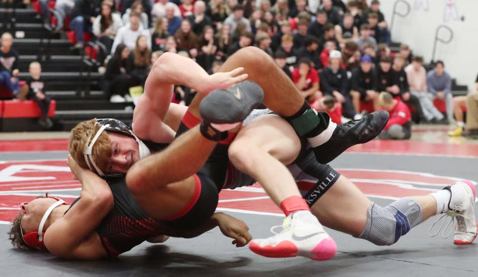 Brecksville's Brock Herman drives Wadsworth's Nick Humphrys to the mat in the 144 weight class match. The senior has risen above the rest in terms of Greater Akron/Canton middleweights.