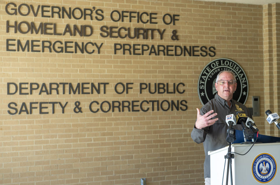 FILE - Louisiana Gov. John Bel Edwards talks about Hurricane Delta damages before flying to southwest Louisiana Saturday Oct. 10, 2020, in Baton Rouge, La. (Bill Feig=labat