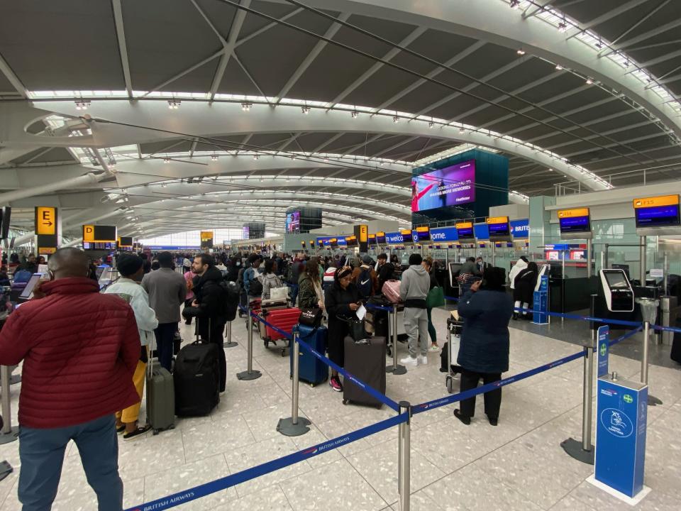 People queuing to check-in at Heathrow Terminal 5 as travellers embarking on overseas trips faced chaos as flights were cancelled and cross-Channel rail services were hit by major delays