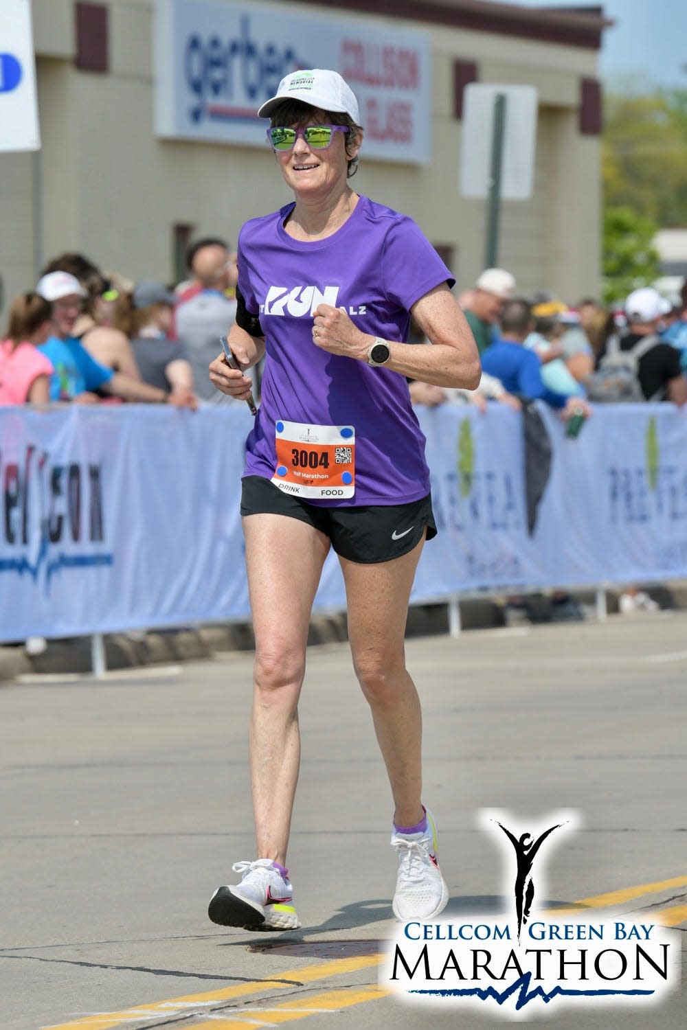 Julie Lawson Carlin runs in May in the Cellcom Green Bay Half Marathon in Wisconsin. She ran the race in memory of her brother, David.