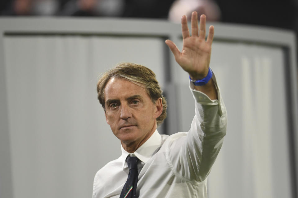 Italy's manager Roberto Mancini waves after a Euro 2020 soccer championship quarterfinal match between Belgium and Italy at the Allianz Arena in Munich, Germany, Friday, July 2, 2021. (Andreas Gebert/Pool Photo via AP)