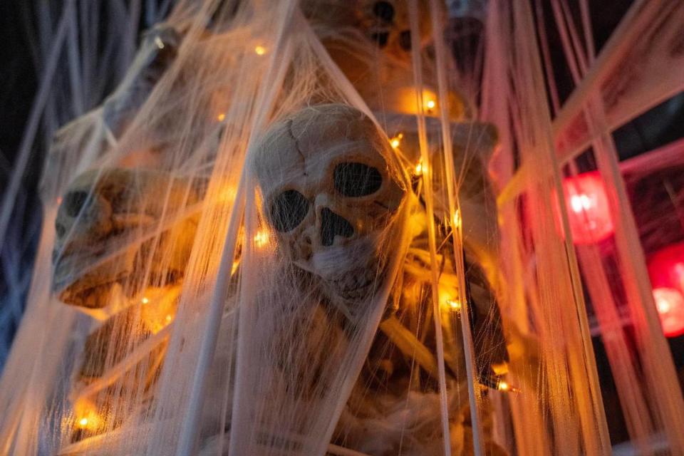 Cobwebs surround a decorative skeleton near the dining area at Cafe Trio.