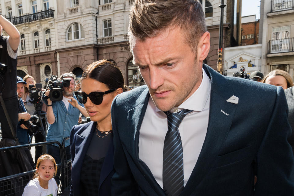 Leicester City striker Jamie Vardy (R) and his wife Rebekah Vardy (L) arrive at the Royal Courts of Justice on the sixth day of the high-profile trial dubbed 