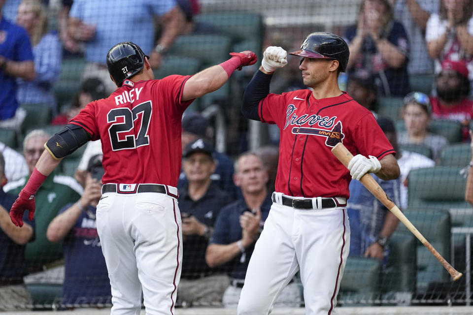 Atlanta Braves' Austin Riley (27) celebrates with Matt Olson after hitting a home run against the Miami Marlins during the third inning of a baseball game Friday, June 30, 2023, in Atlanta. (AP Photo/John Bazemore)