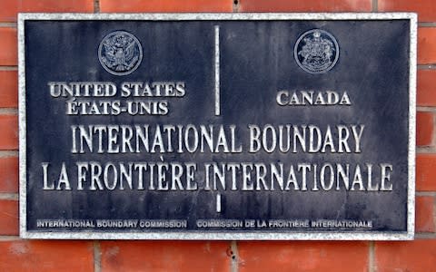 A marker for the United States-Canada border - Credit: Adam Nadel