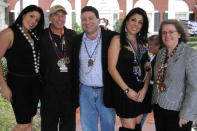 (L to R) Natalie Khawam, Gen. David Petraeus, Dr. Scott Kelley, Jill Kelley and Holly Petraeus, attend the Gasparilla parade on Jan. 30. 2010, in Tampa, Fla. Jill Kelley was identified as the woman who received threatening emails from the biographer of Gen. David Petraeus, Paula Broadwell, with whom he allegedly had an affair. (AP Photo/The Tampa Bay Times, Amu Scherzer)