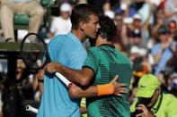 Mar 30, 2017; Miami, FL, USA; Roger Federer of Switzerland (R) hugs Tomas Berdych of the Czech Republic (L) after their match in a men's singles quarter-final during the 2017 Miami Open at Crandon Park Tennis Center. Federer won 6-2, 3-6, 7-6(6). Geoff Burke-USA TODAY Sports