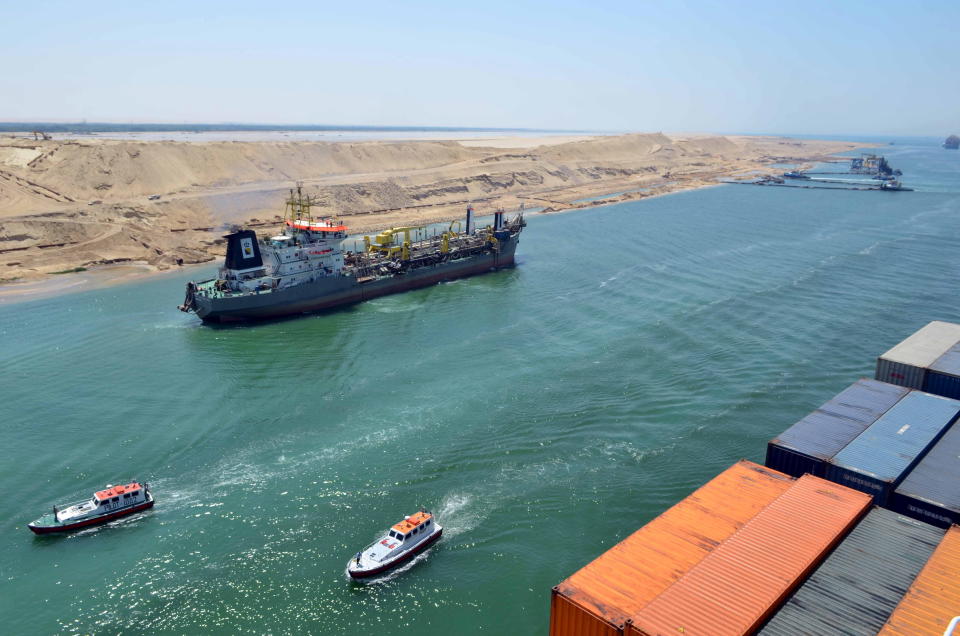 A cargo ship is seen crossing through the New Suez Canal, Ismailia, Egypt, July 25, 2015.A cargo ship is seen crossing through the New Suez Canal, Ismailia, Egypt, July 25, 2015.