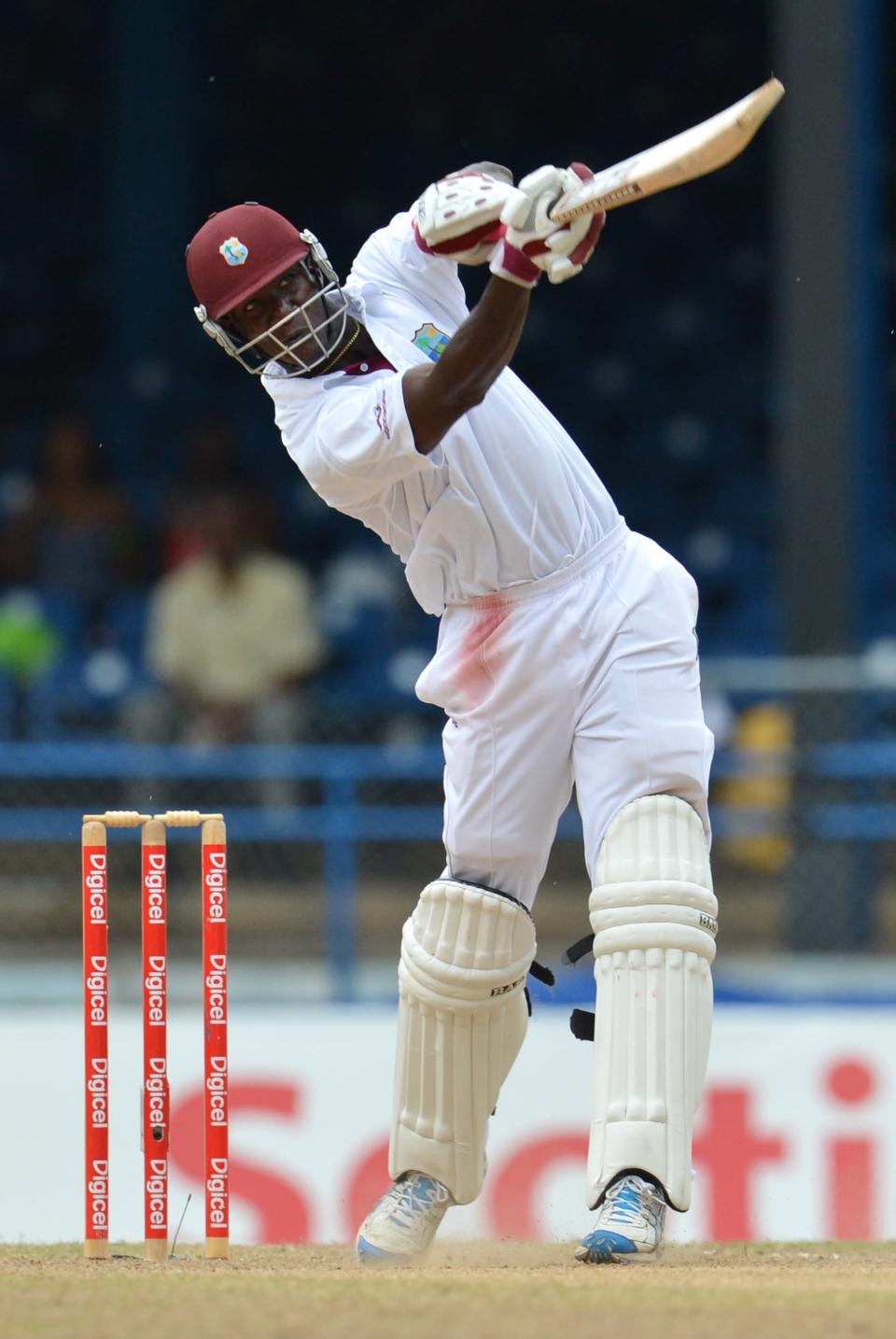 West Indies Darren Sammy launches a six off Australian bowler Ben Hilfenhaus during the final day of the second-of-three Test matches between Australia and West Indies April 19, 2012 at Queen's Park Oval in Port of Spain, Trinidad.