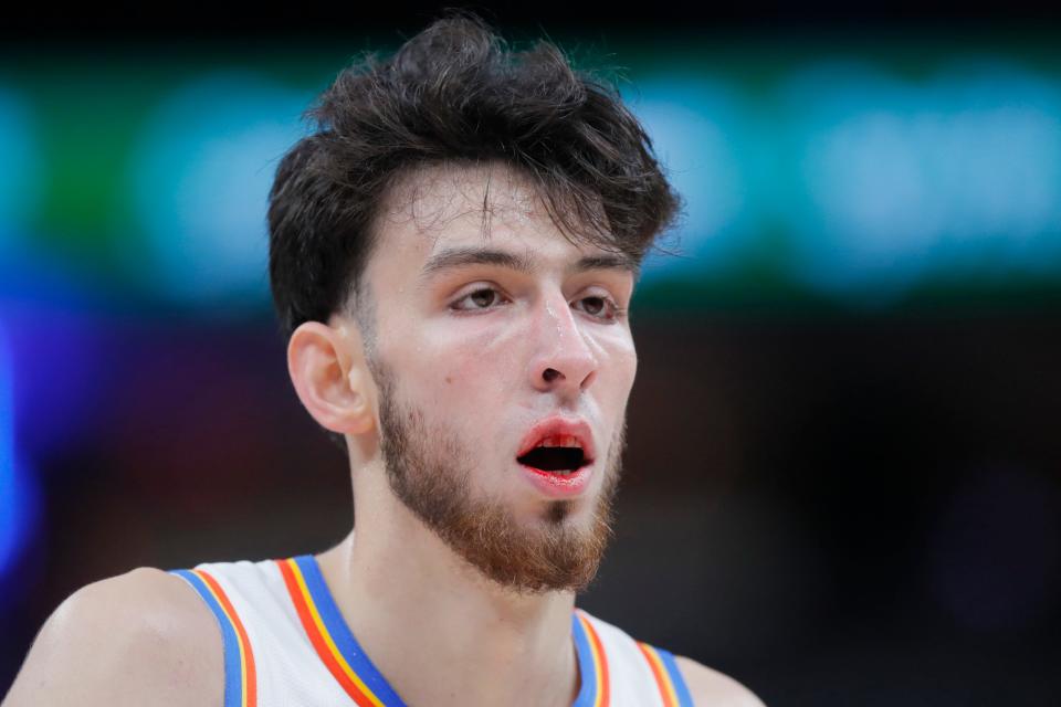 Thunder forward Chet Holmgren (7) walks to the bench with blood in his mouth after a collision with  Spurs center Victor Wembanyama.