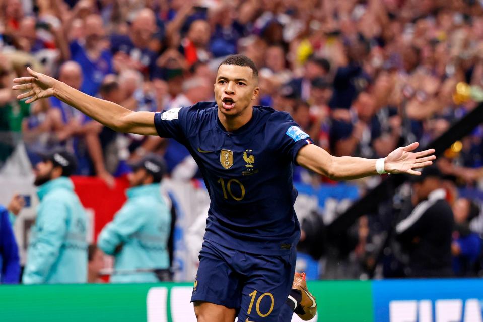 France forward Kylian Mbappe celebrates after scoring a goal against Argentina on a penalty kick for his third goal of the match during extra time of the 2022 World Cup final.