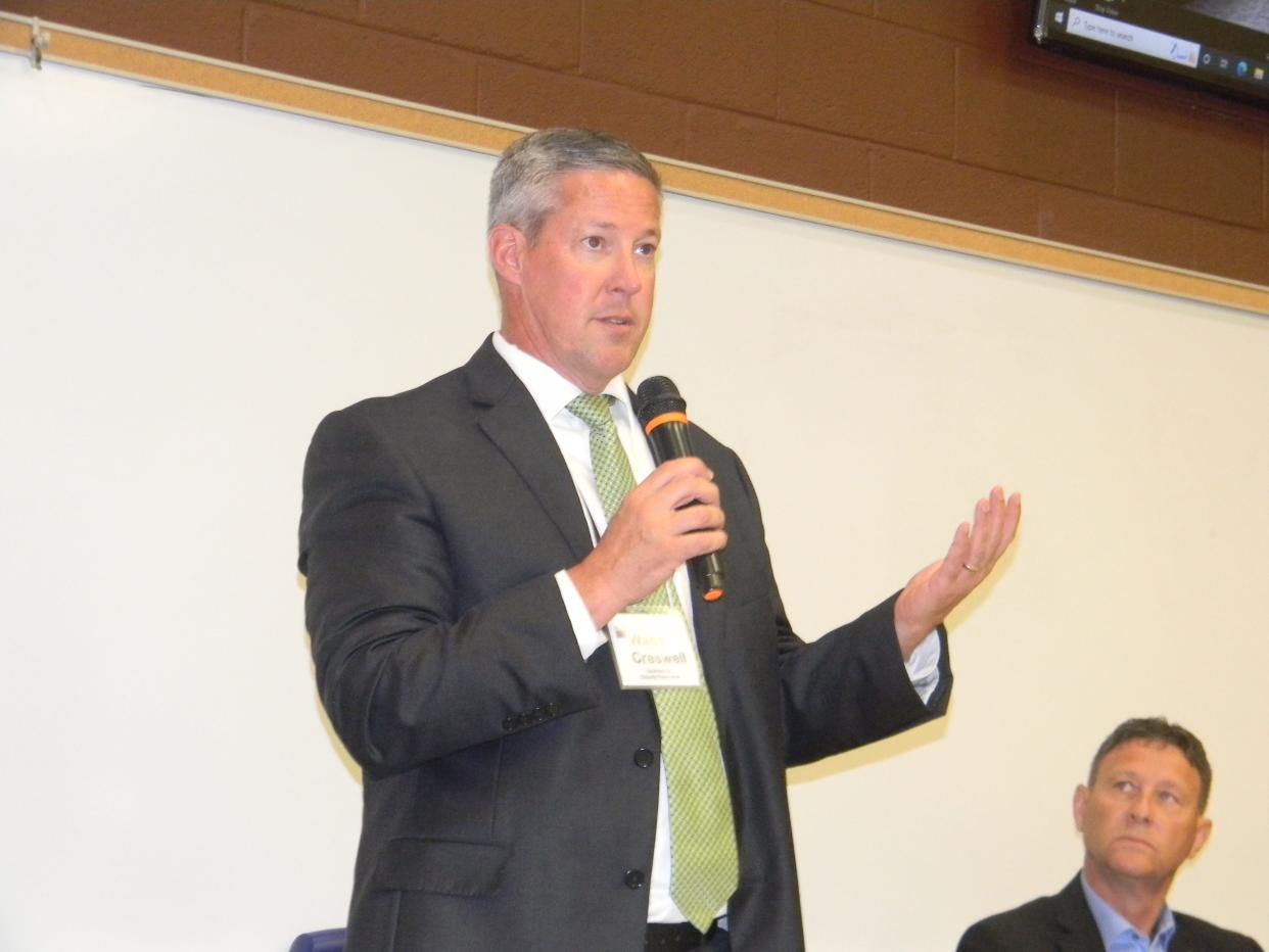 Wade Creswell speaks during a July 12 Roane County Candidates Forum hosted by the League of Women Voters of Oak Ridge, while Wayne Best listens. Creswell beat Best in the election for Roane County executive.