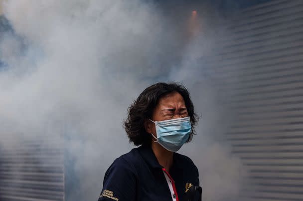 PHOTO: A woman reacts after riot police fired tear gas to disperse protesters taking part in a pro-democracy rally against a proposed new security law in Hong Kong on May 24, 2020. (AFP via Getty Images, FILE)